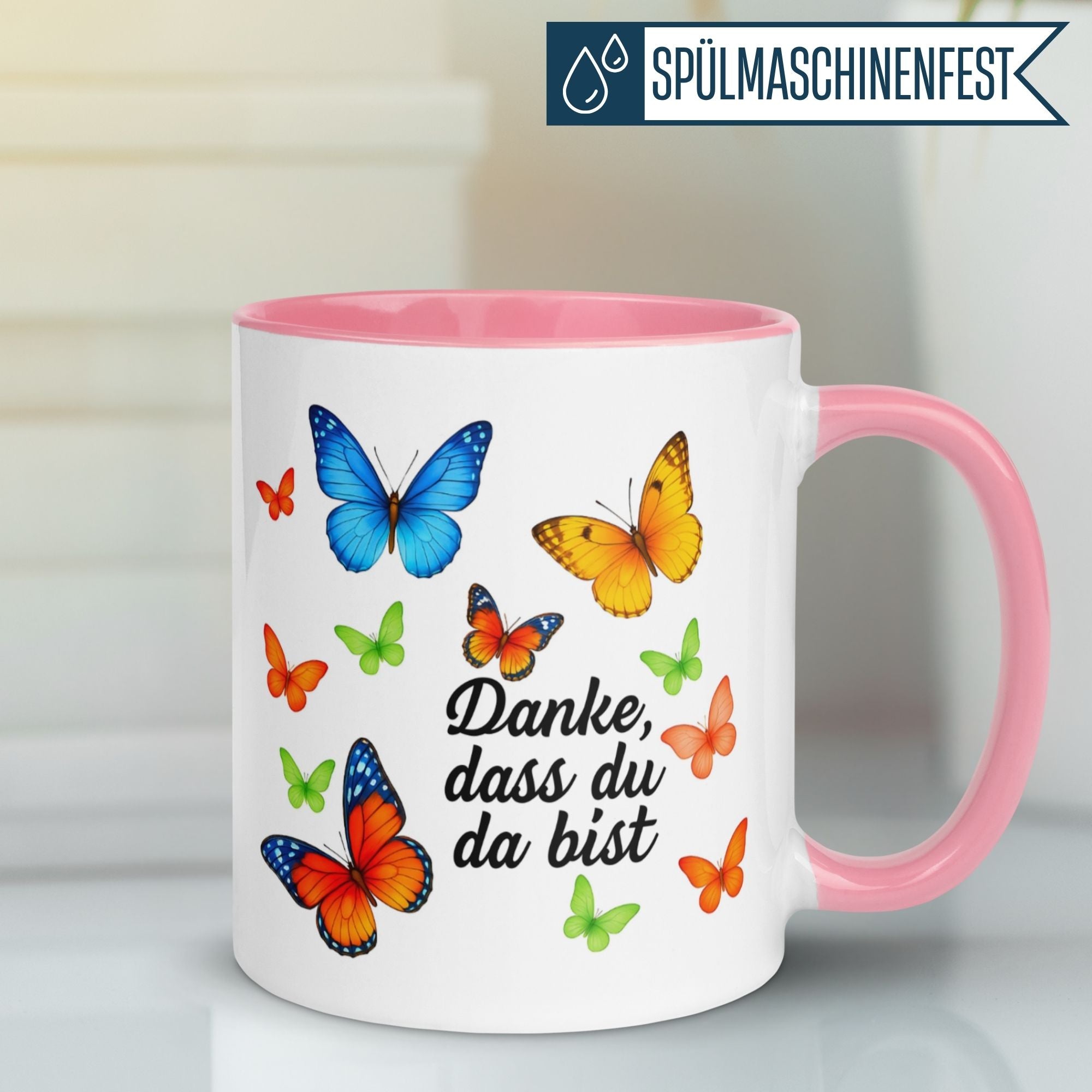 Momentals Tasse mit bunten Schmetterlingen und "Danke, dass du da bist" Spruch, perfekt für Wertschätzung.
