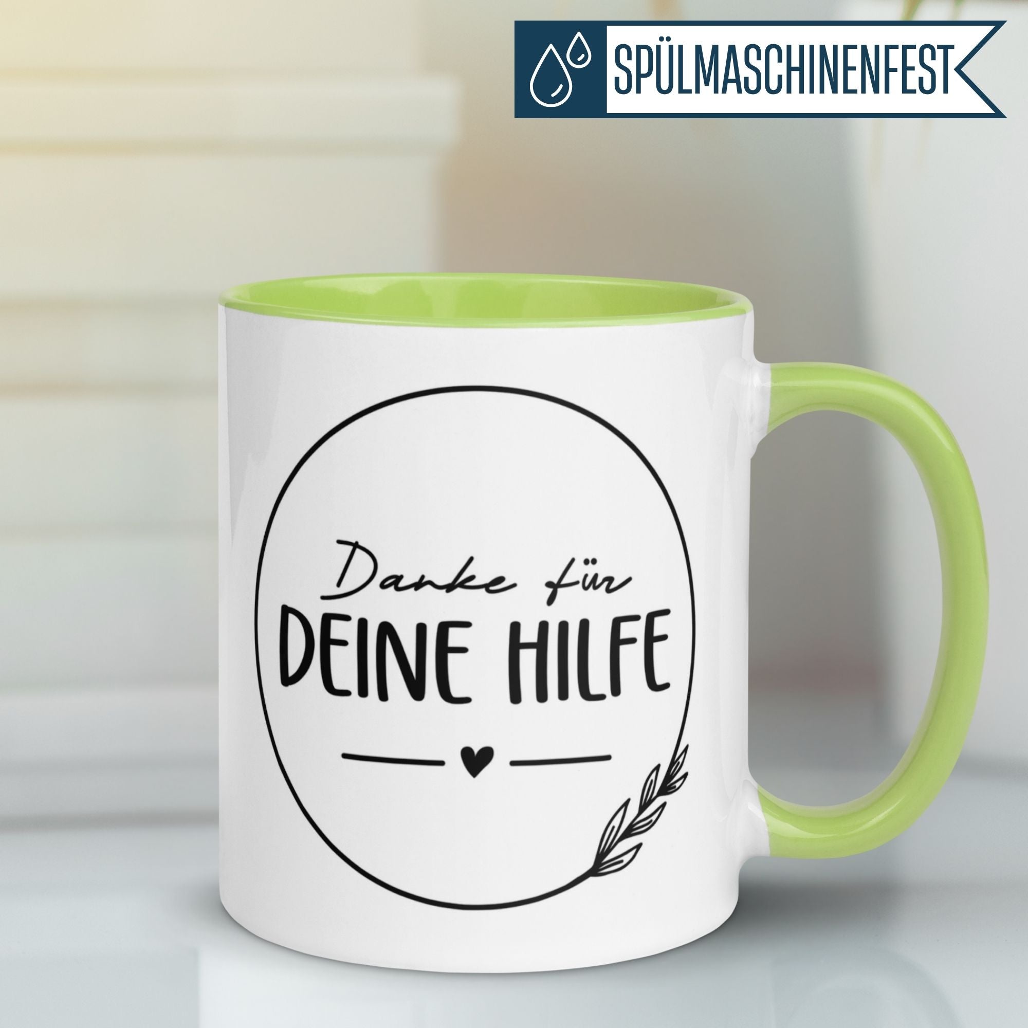 Momentals® Tasse in Weiß und Grün mit dem Spruch 'Danke für deine Hilfe' im eleganten Design.