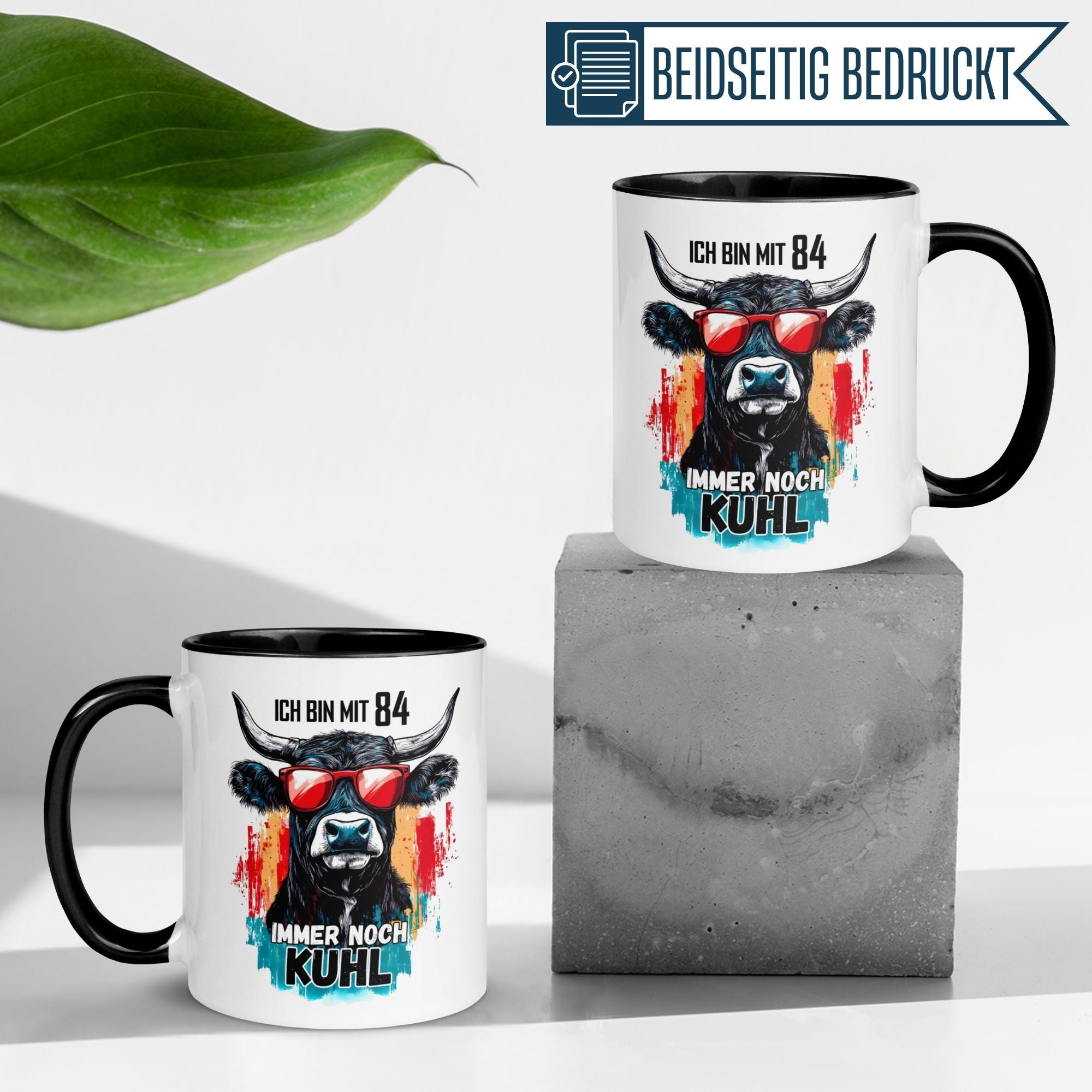 Humorous birthday mug featuring cow design with text 'Ich bin mit 84 immer noch KUHL', perfect gift for 84th birthday.