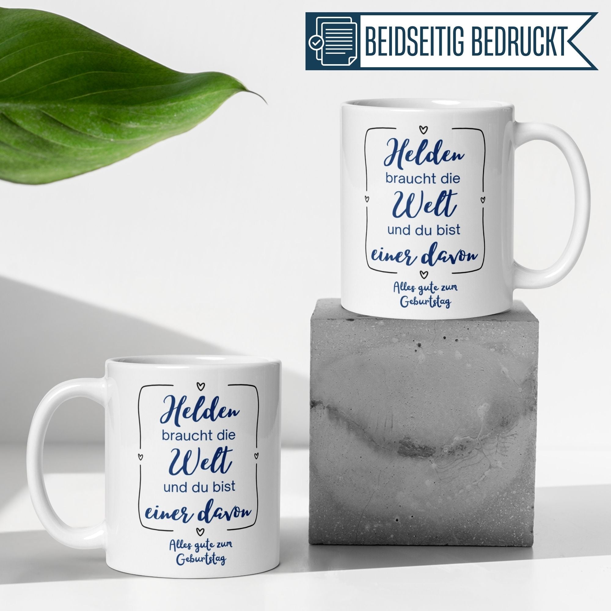 Momentals® Tasse mit Spruch für Alltagshelden zum Geburtstag, beidseitig bedruckt, weißes Keramikdesign.