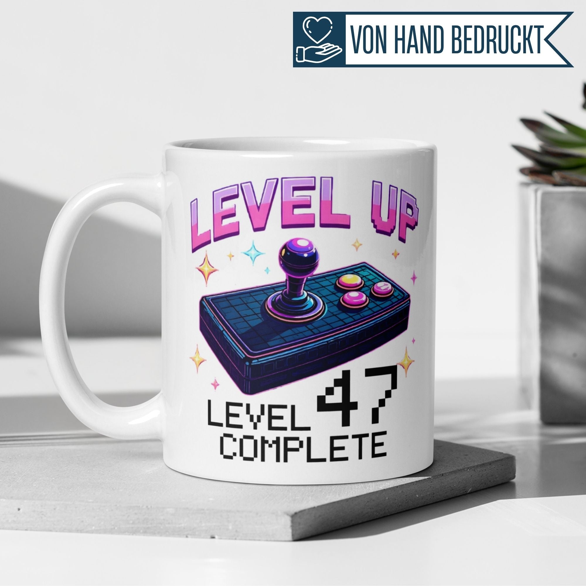 Stylish gaming mug celebrating 47th birthday, featuring 'Level Up' and retro joystick design.