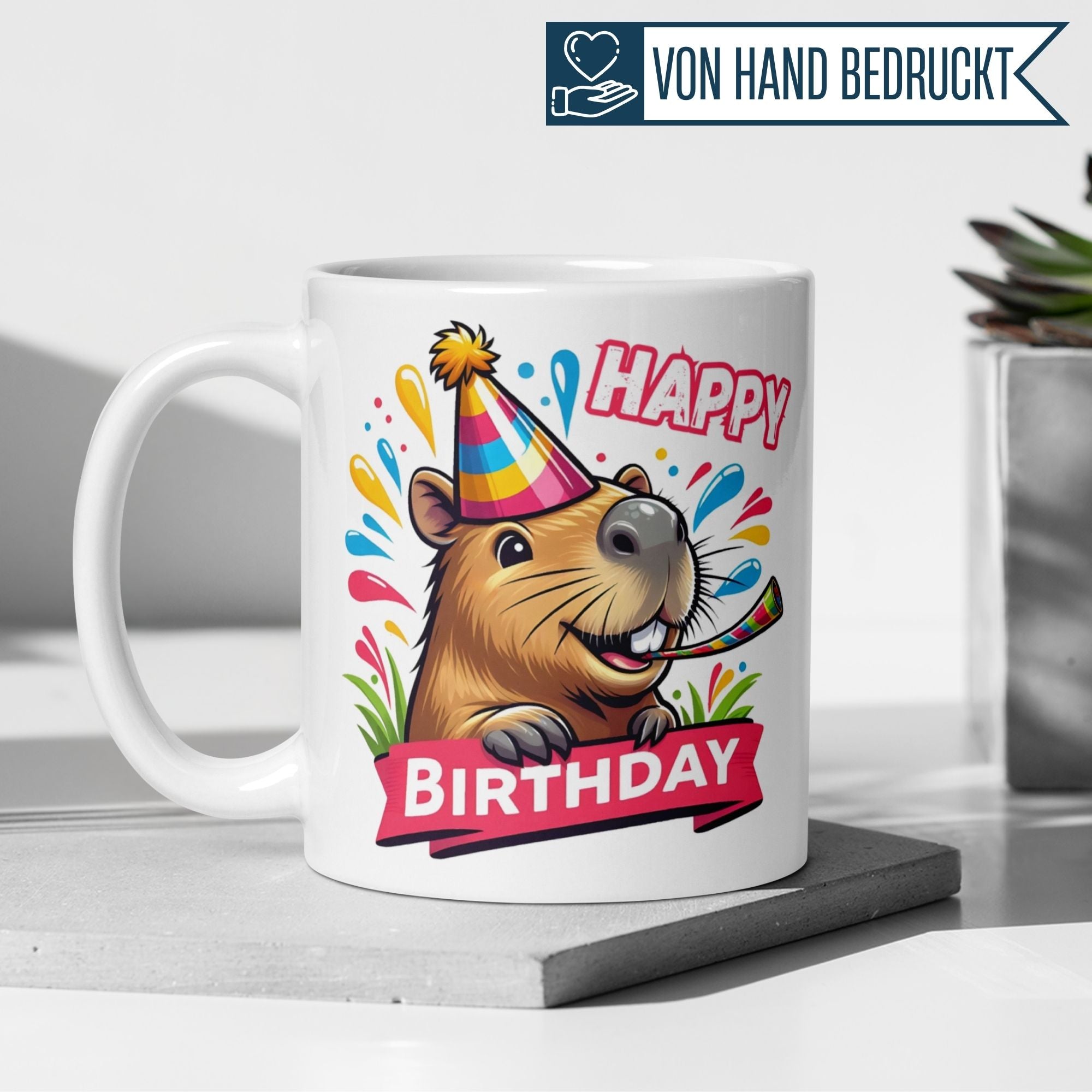 Colorful capybara birthday mug with party hat and confetti for cheerful celebrations.