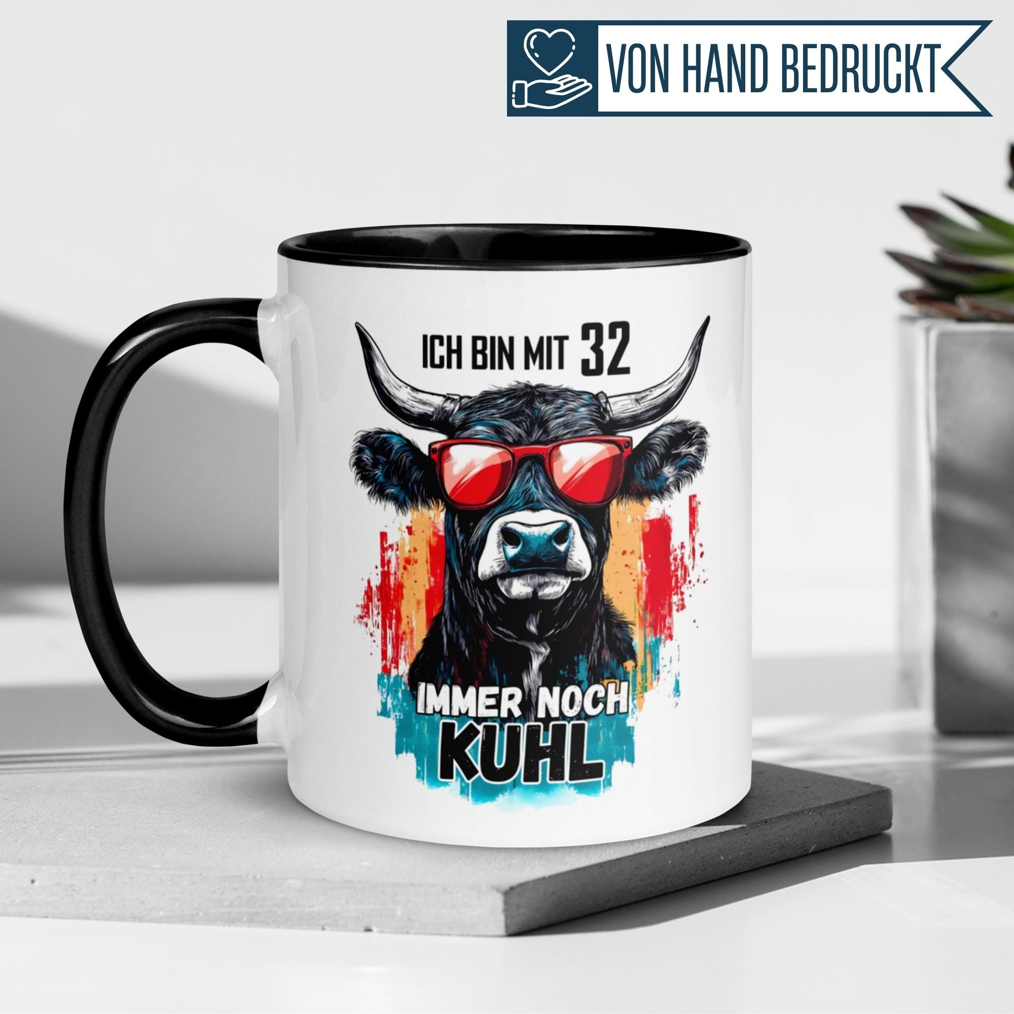 Humorous birthday mug featuring a cow and the phrase 'Immer noch kuhl' for turning 32.