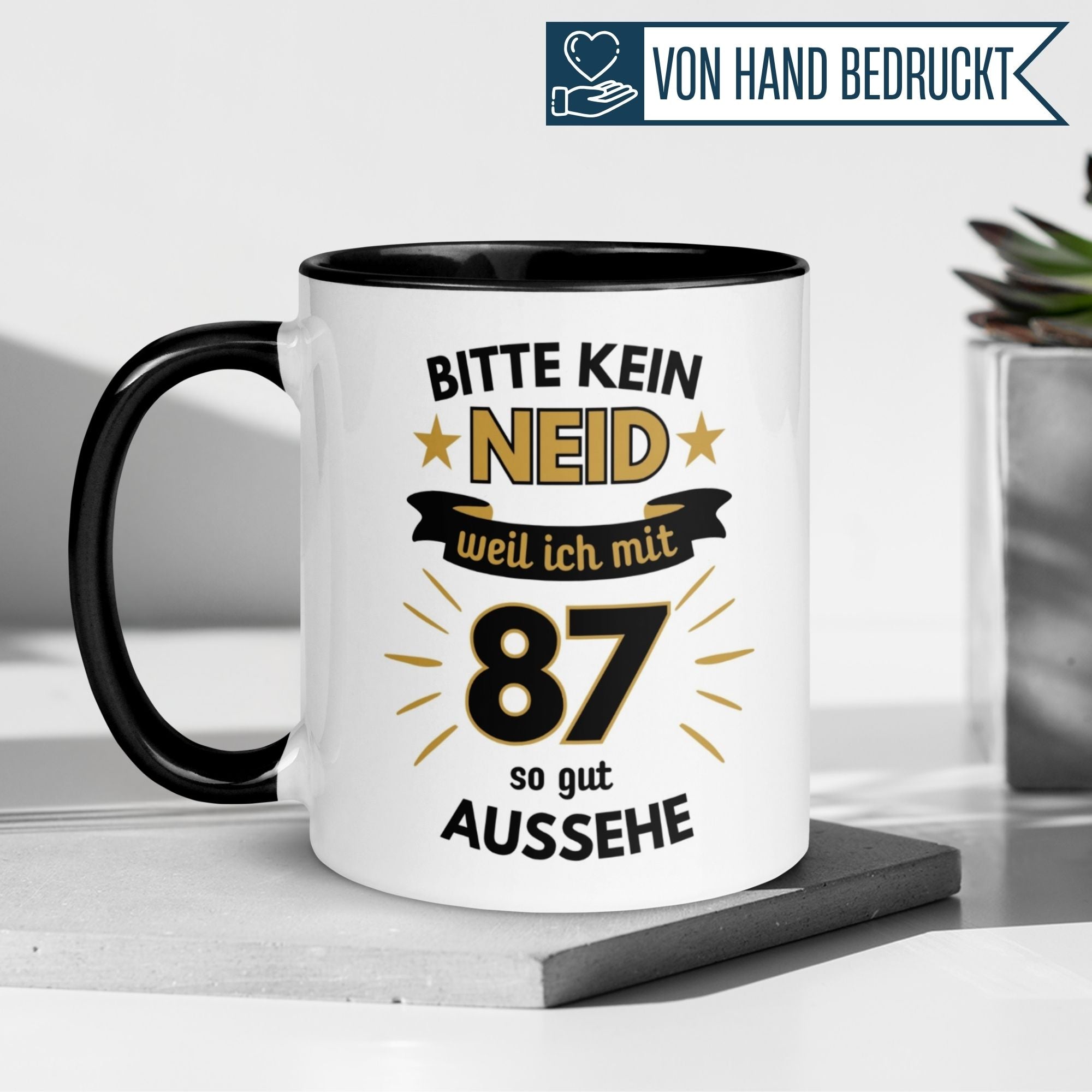 Humorous birthday mug for 87th birthday with saying 'Bitte kein Neid – weil ich mit 87 so gut aussehe'.