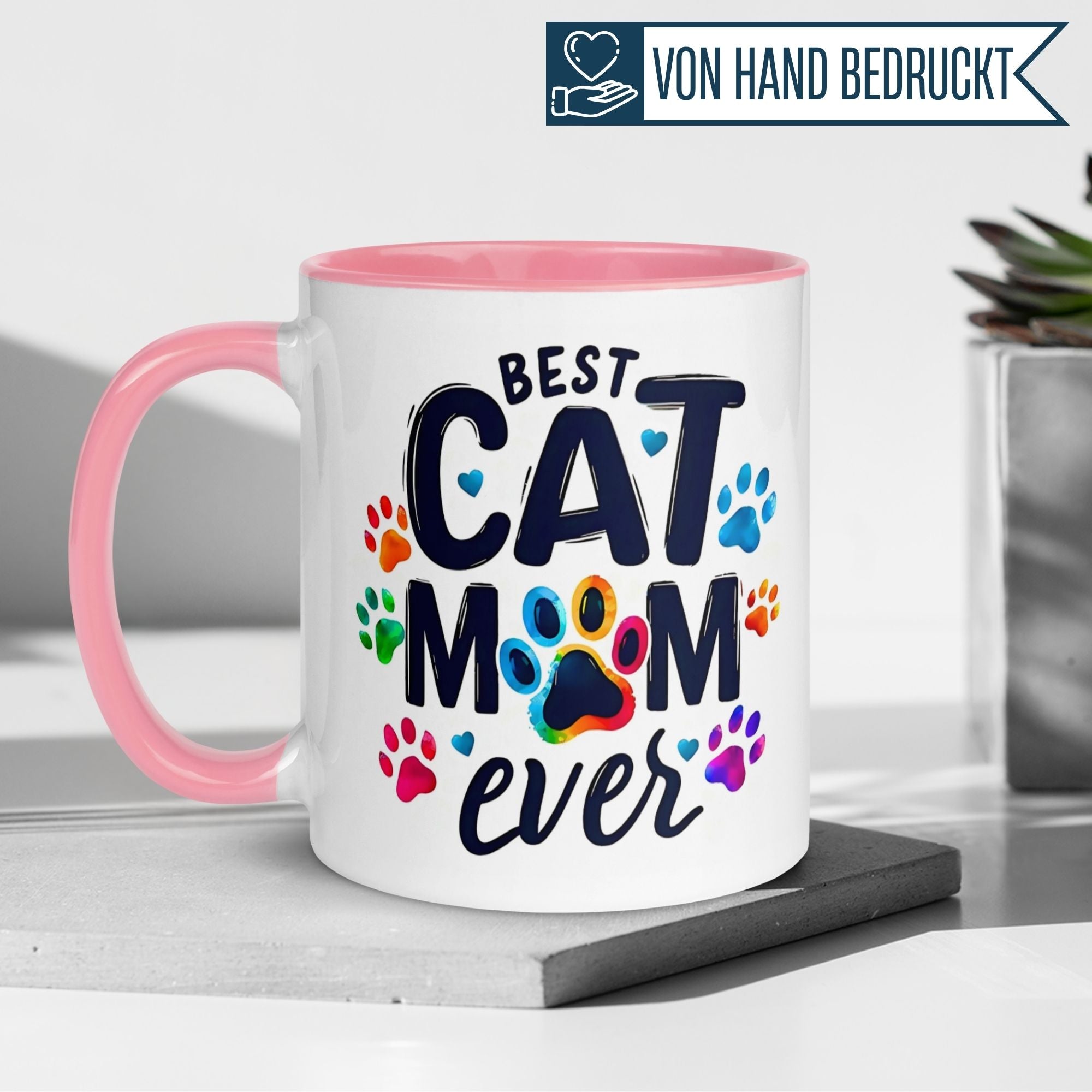 Momentals Tasse für Katzenliebhaber: "Best Cat Mom Ever" mit bunten Pfotenabdrücken, charmantes Design.