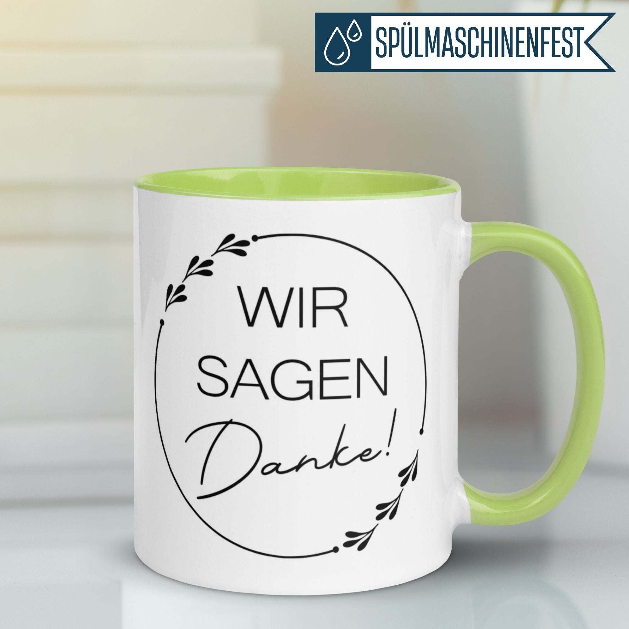 Momentals Tasse mit Spruch "Wir sagen Danke!" und grünem Henkel für Wertschätzung in jedem Schluck.