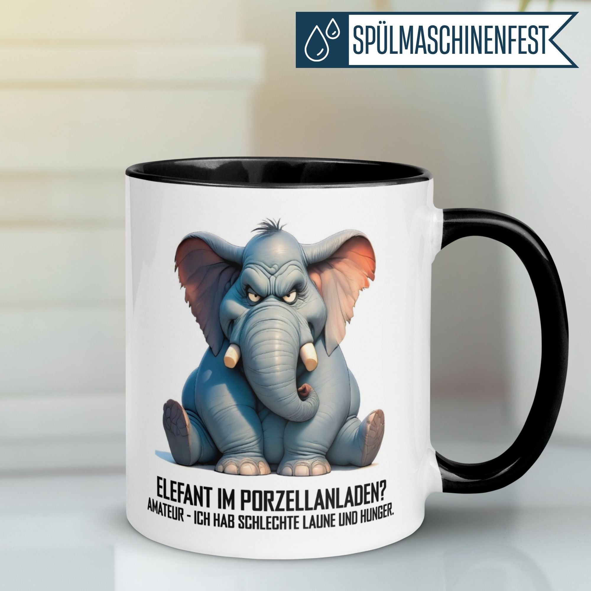 Schwarze Tasse mit Elefantenmotiv und Spruch für Morgenmuffel: "Amateur – ich hab schlechte Laune und Hunger."
