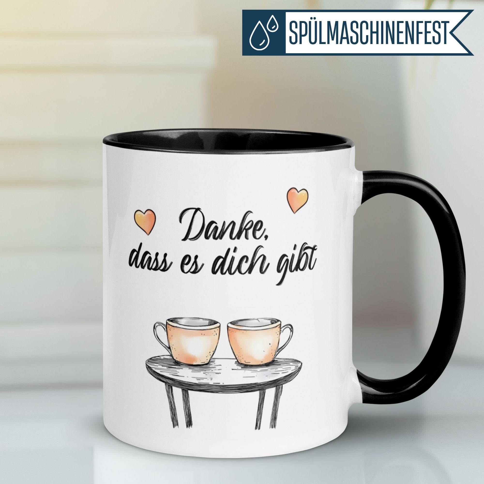 Momentals Tasse Danke mit herzlichen Motiven und zwei Kaffeetassen auf einem Tisch, perfekte Geschenkidee.