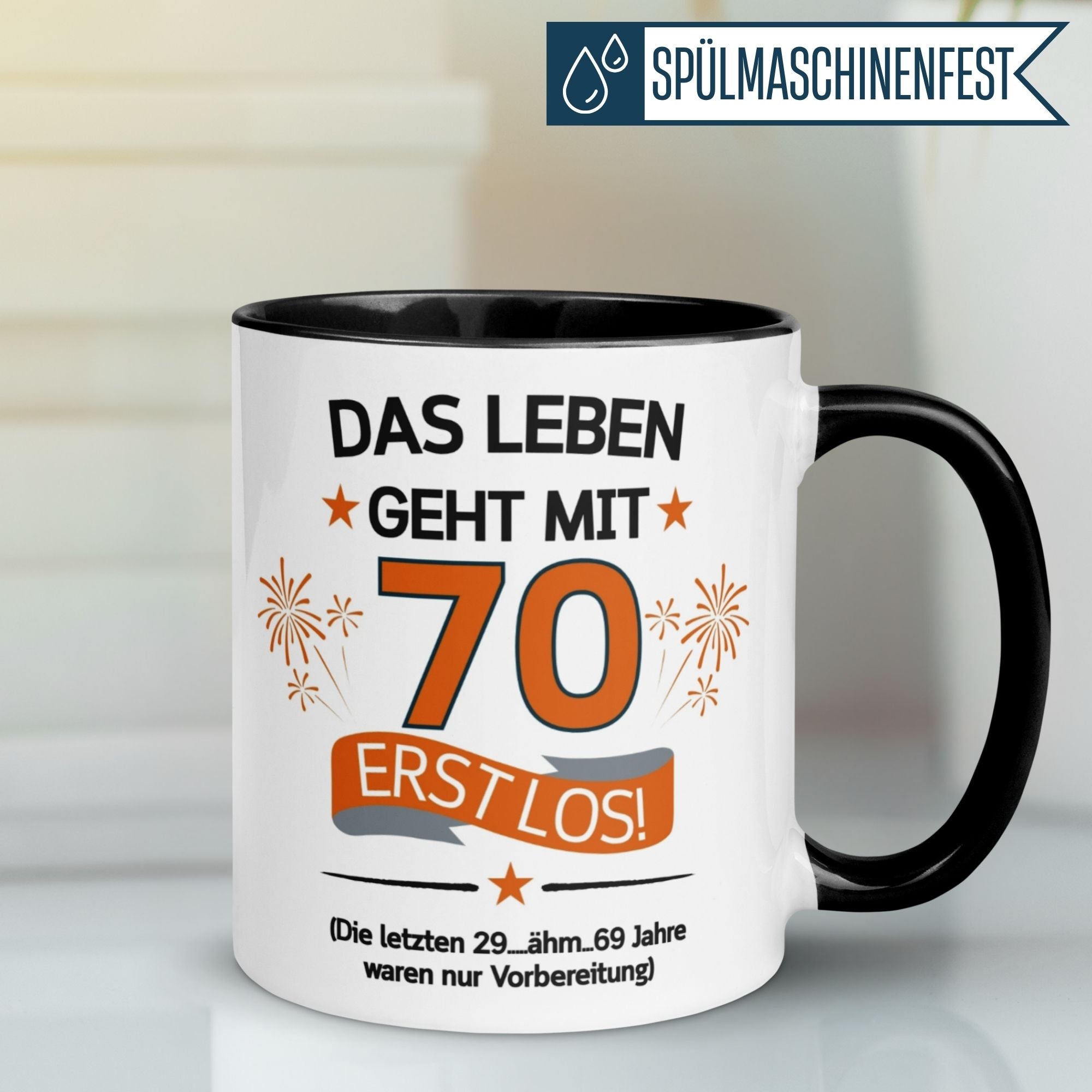 Humorous Momentals® coffee mug for 70th birthday, featuring the quote: "Das Leben geht mit 70 erst los!"