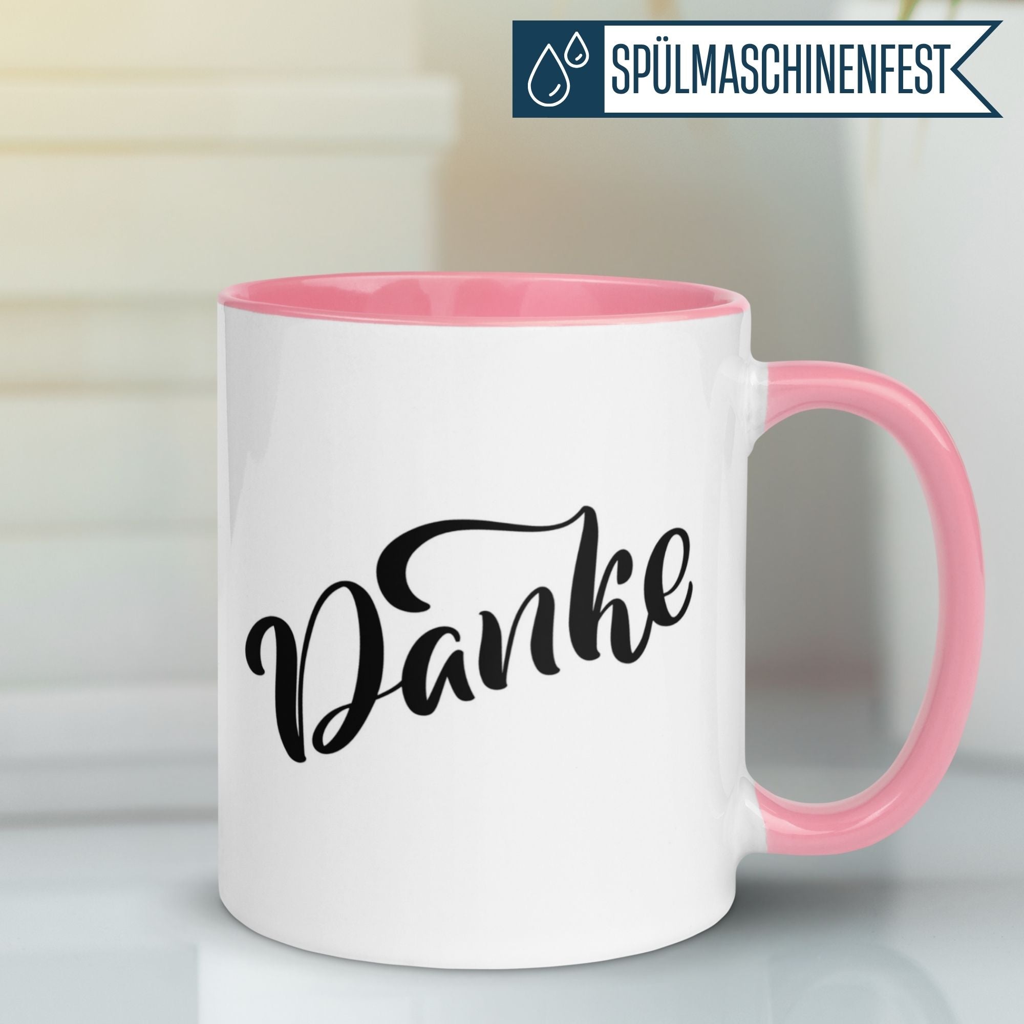 Stylish Momentals mug with 'Danke' lettering, perfect for expressing appreciation during coffee breaks.