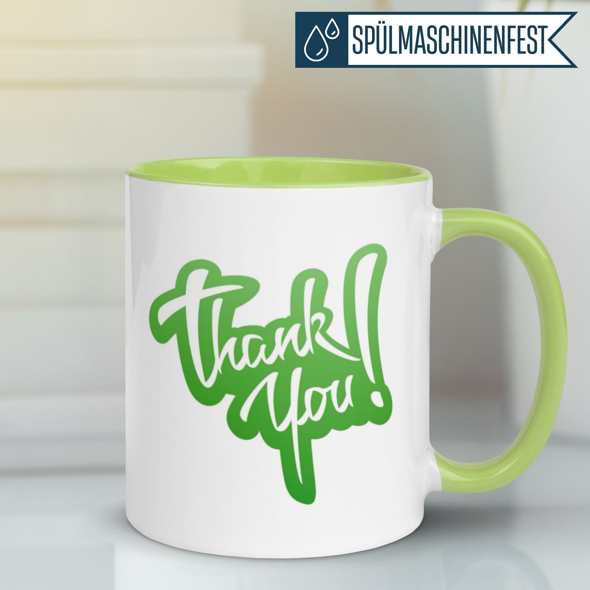 Momentals® Tasse Dankeschön mit grünem Schriftzug "Thank You!" auf weißem Hintergrund.