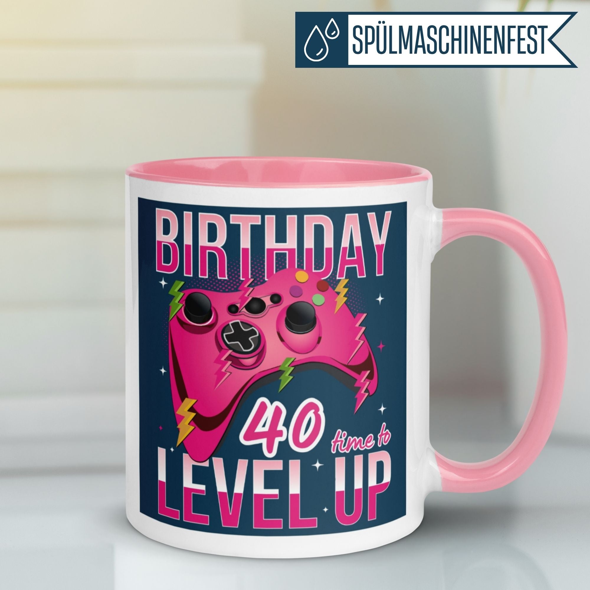 Momentals 40th birthday mug with pink game controller design and Level Up text, perfect gift for gamers.