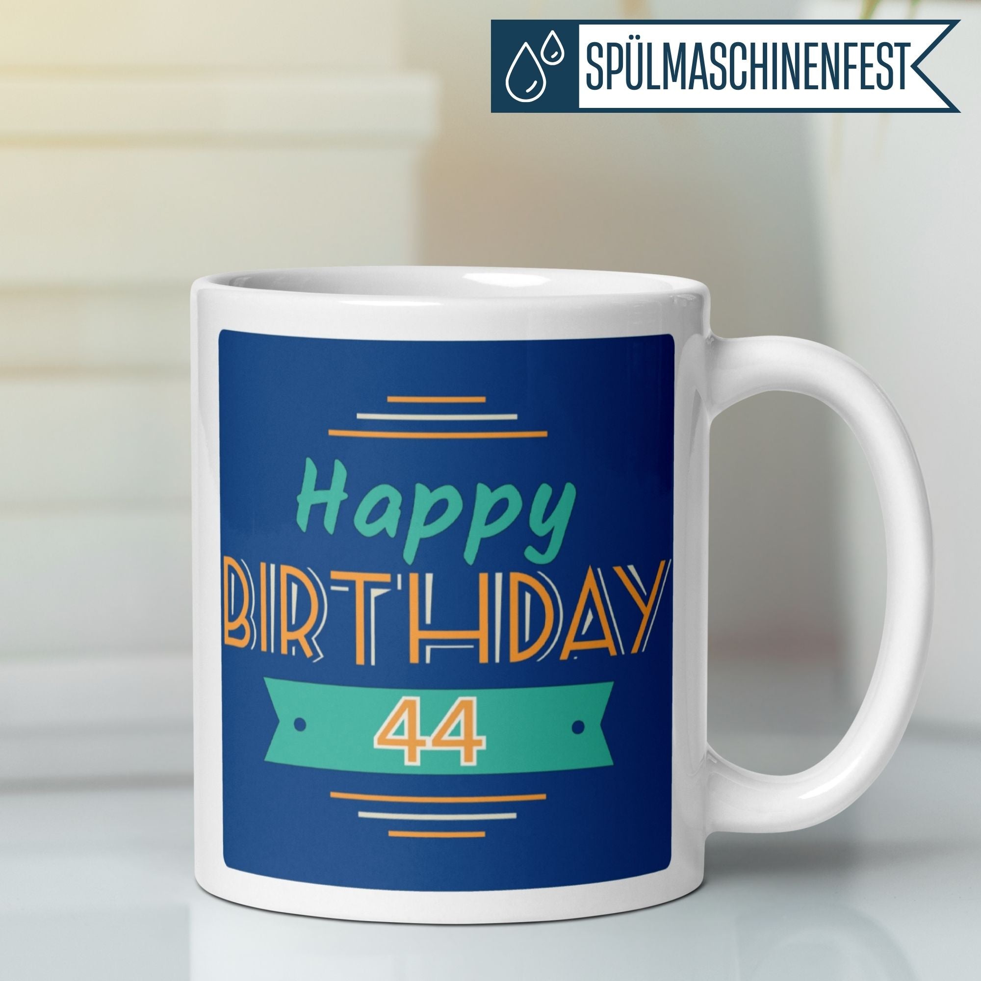 Farbenfrohe Tasse zum 44. Geburtstag mit Aufschrift „Happy Birthday 44“ auf blauem Hintergrund.