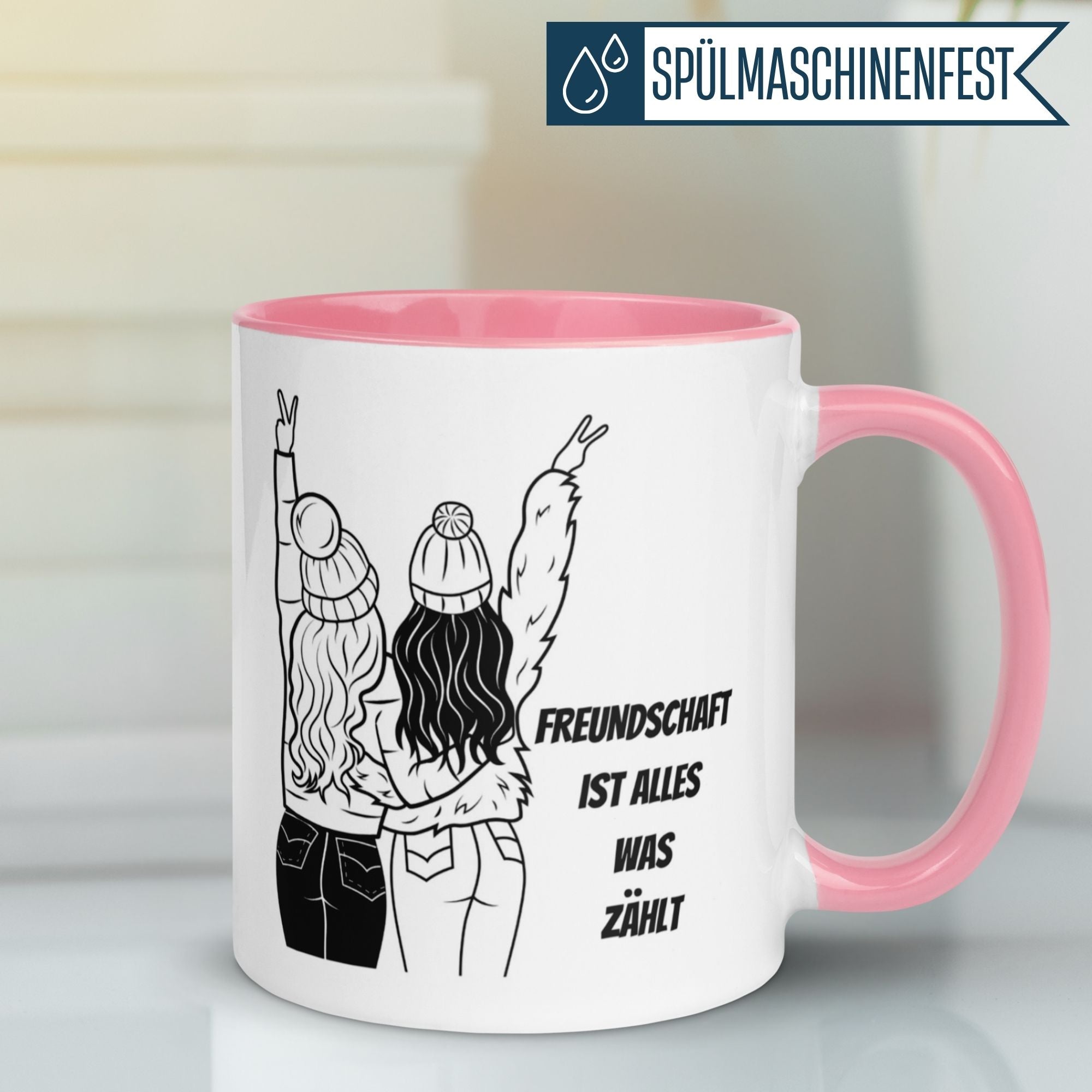 Momentals Tasse mit zwei Freundinnen und der Aufschrift „Freundschaft ist alles was zählt“ in Schwarz-Weiß.