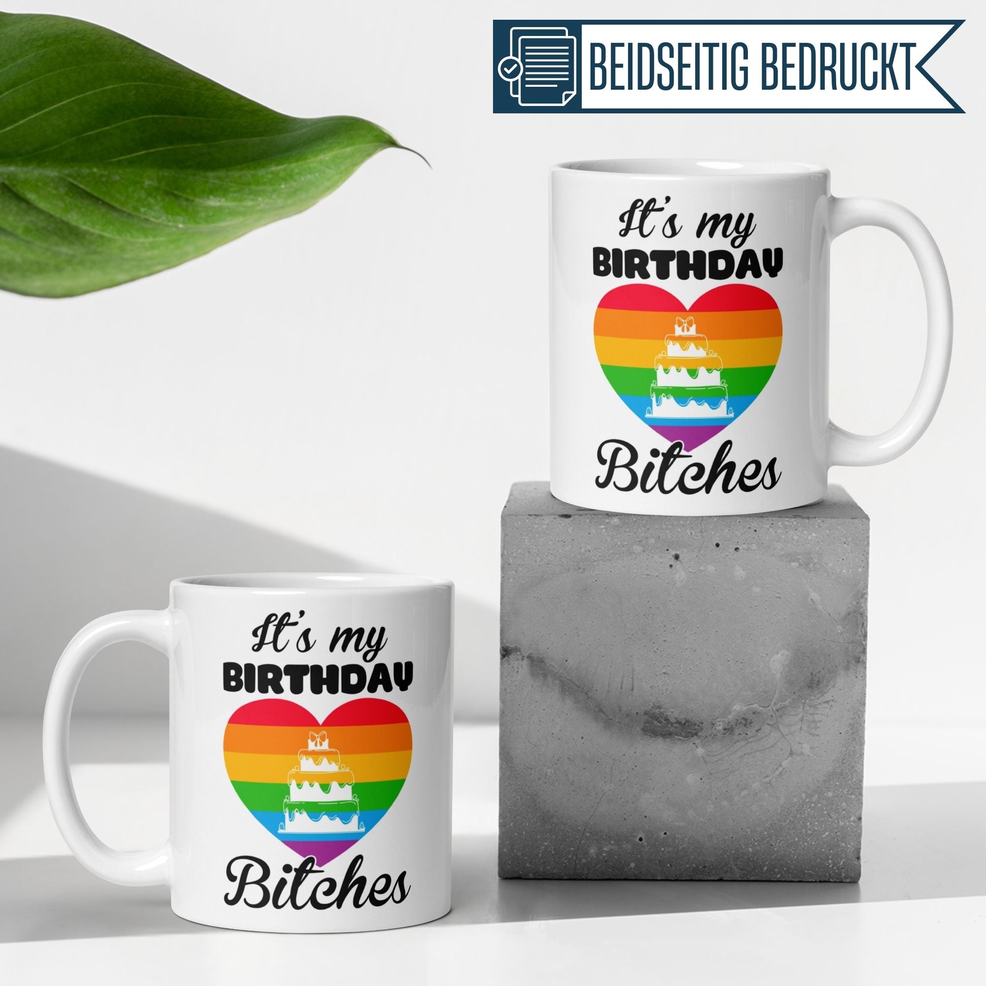 Colorful birthday mugs with rainbow heart and cake design, featuring the phrase 'It's my Birthday Bitches!' for festive celebrations.