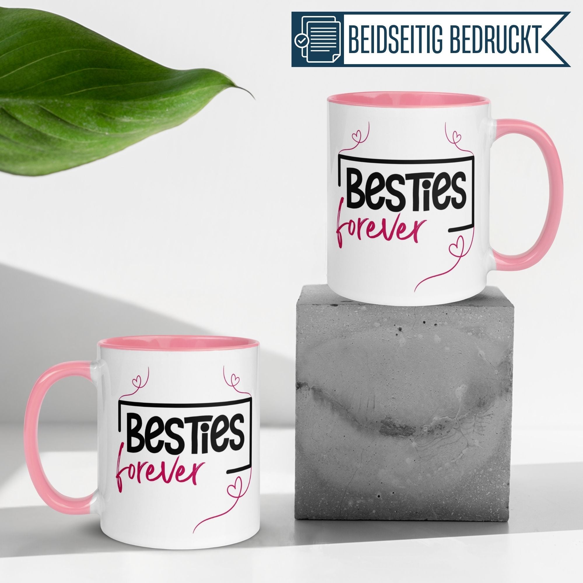 Momentals® Tasse mit dem Schriftzug 'Besties forever', pinke Innenfarbe und Herzlinie, modernes Design.
