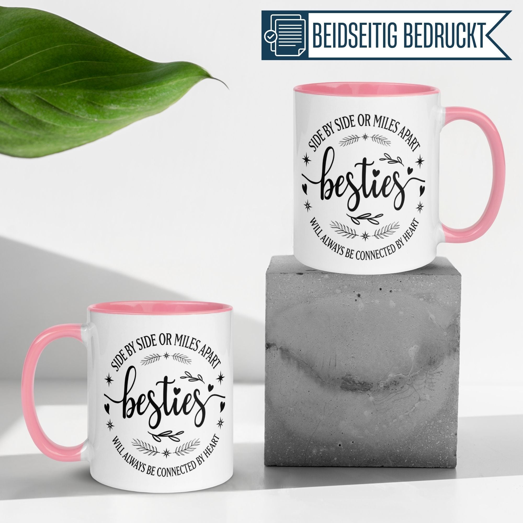 Momentals® Tasse in Pink mit Schriftzug "besties" und Herz-Motiv, ideal für Freundschaftsgeschenke.