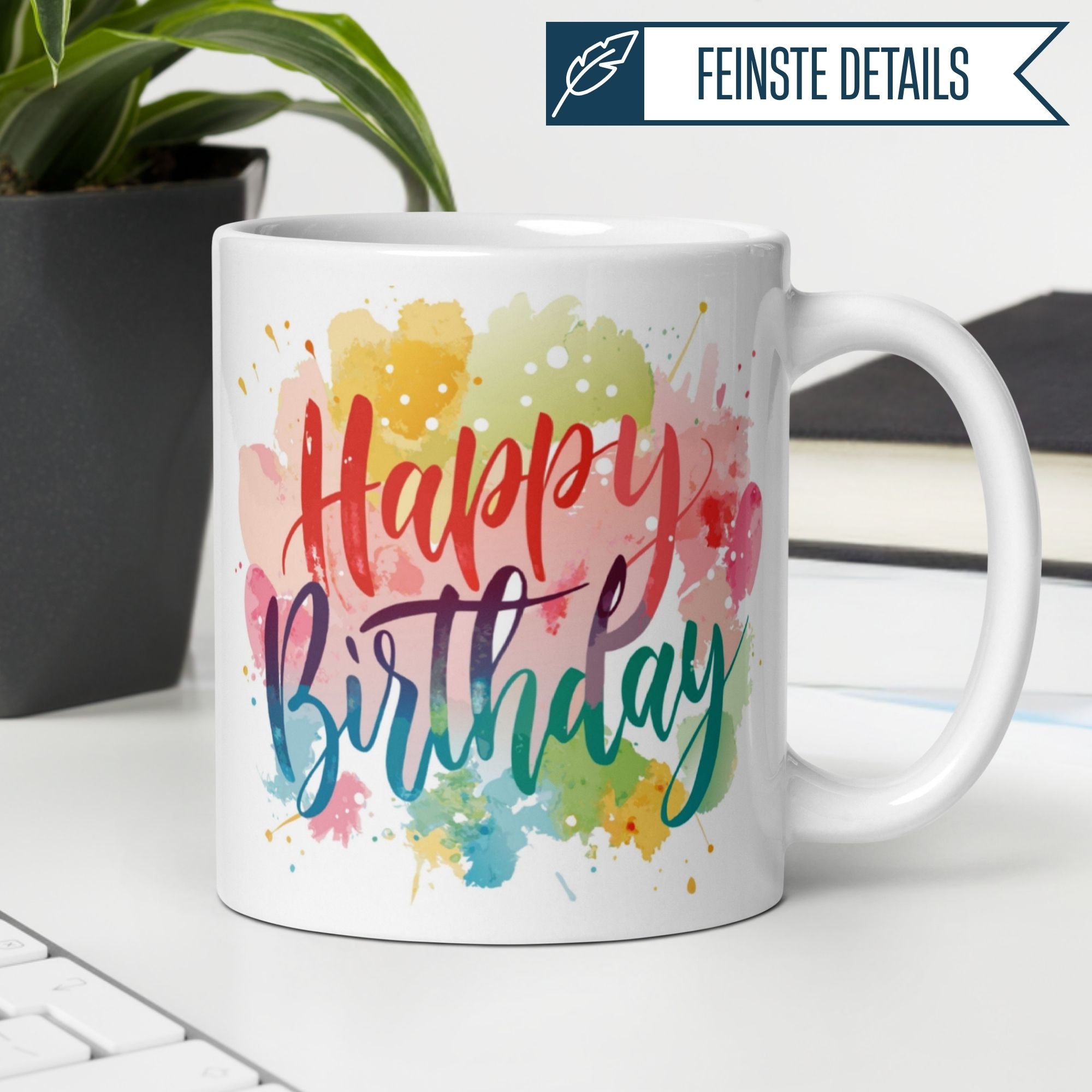 Bunte Momentals® Tasse mit Schriftzug "Happy Birthday" auf Aquarell-Hintergrund, perfekt für Geburtstagsgeschenke.