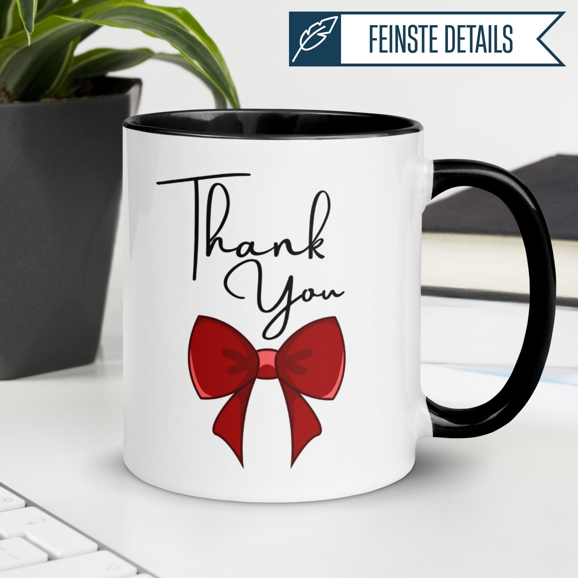 Momentals® Tasse mit roter Schleife und "Thank You" für wertschätzende Kaffeepausen.
