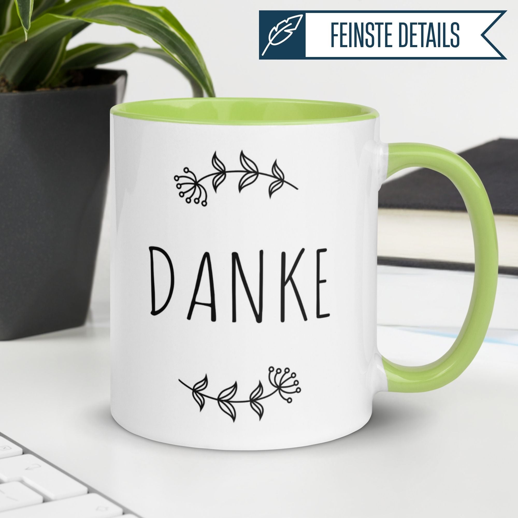 Momentals® Tasse mit dem Schriftzug "DANKE" und floralem Design, ideal für Wertschätzung in jeder Kaffeepause.