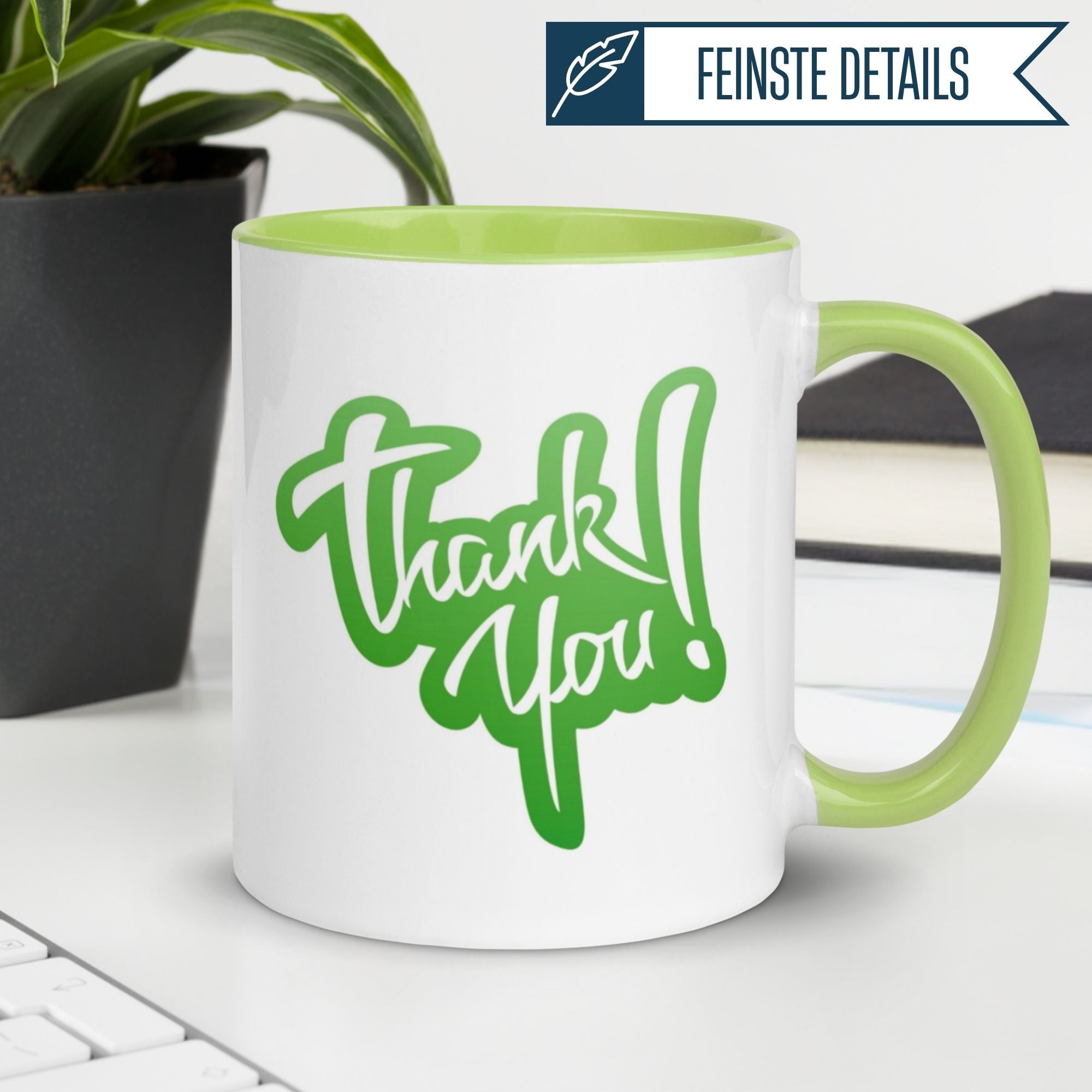 Stylish Momentals® Tasse sagen Danke mit grünem Schriftzug "Thank You!" auf weißem Hintergrund.