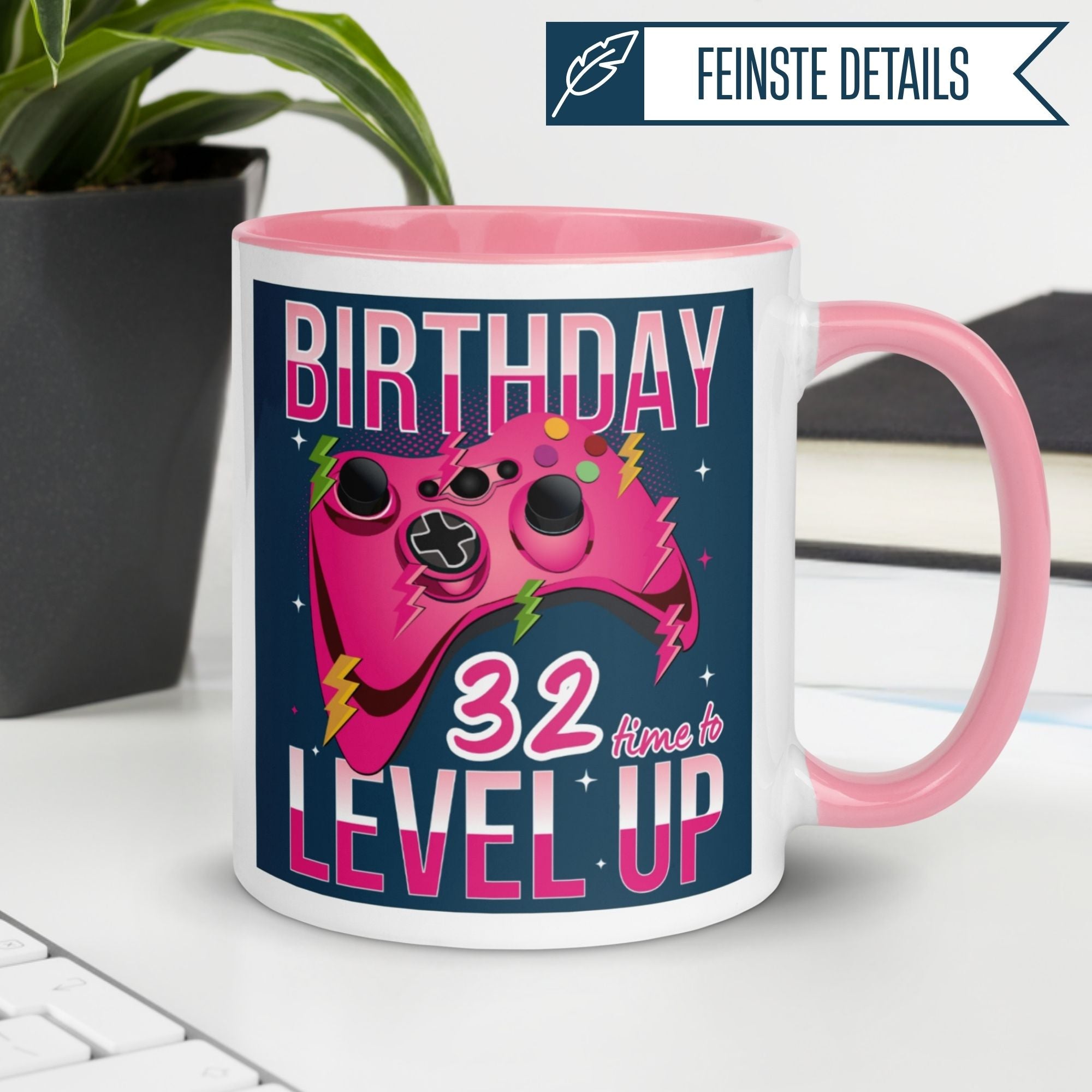 Momentals® birthday mug for gamers celebrating 32nd level up with pink design and gaming controller.