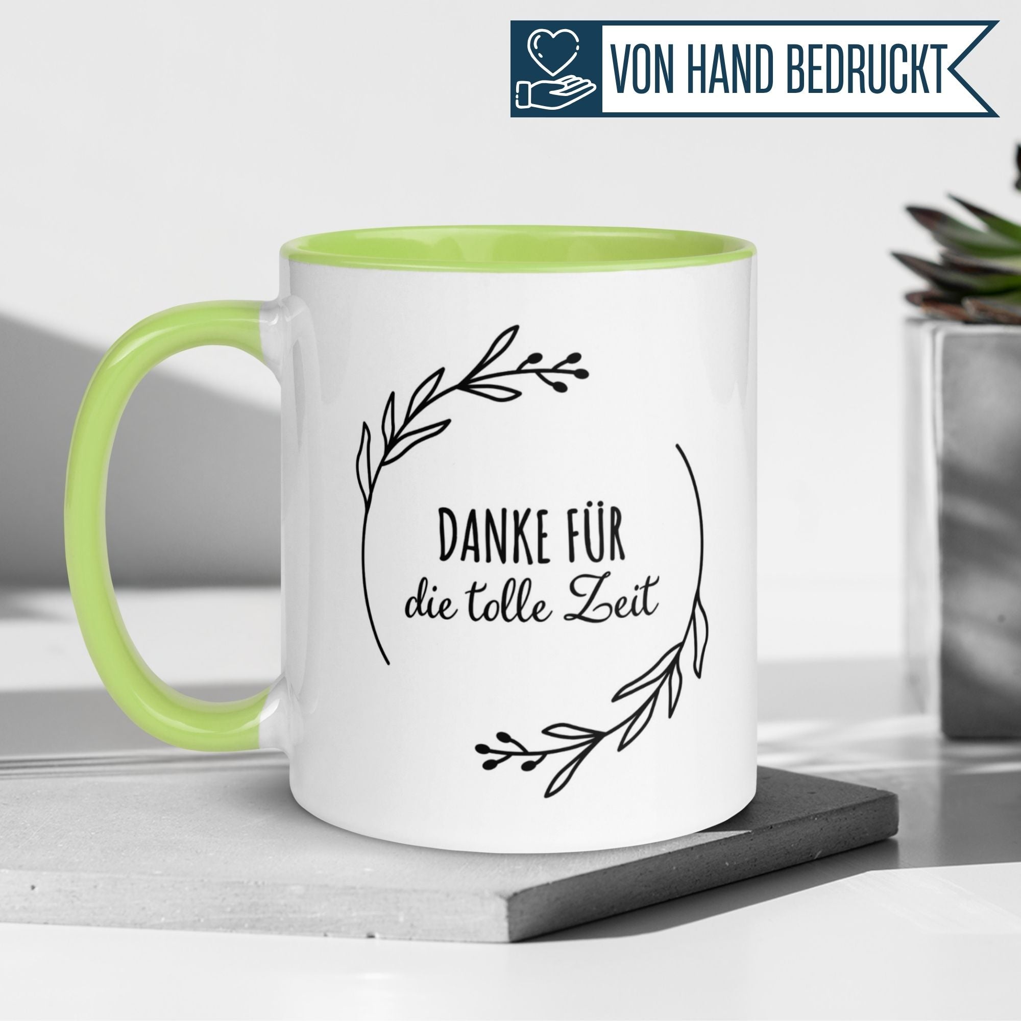 Momentals® Tasse in Weiß und Grün mit dem Spruch 'Danke für die tolle Zeit' und feinen Blätterzweigen.
