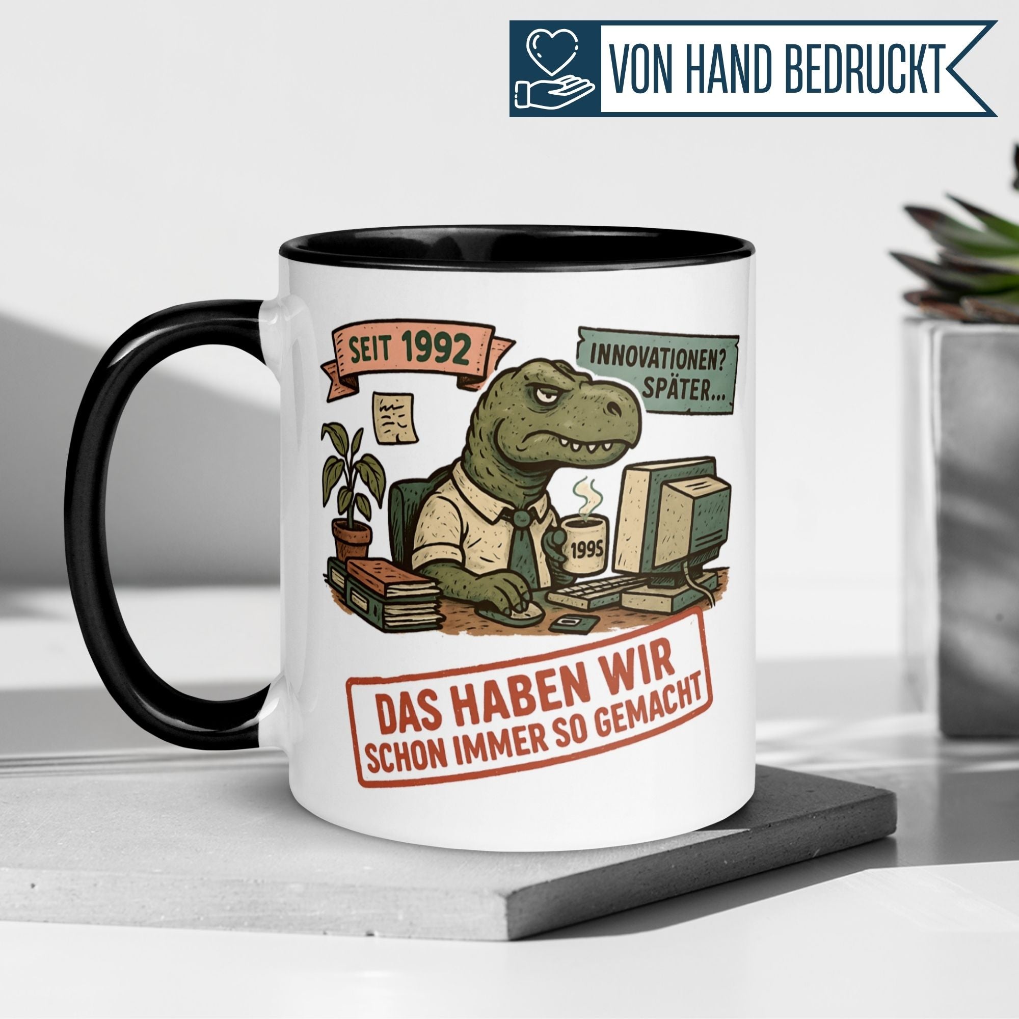 Momentals Chef Mug with T-Rex in office, saying 'Das haben wir schon immer so gemacht', perfect farewell gift.