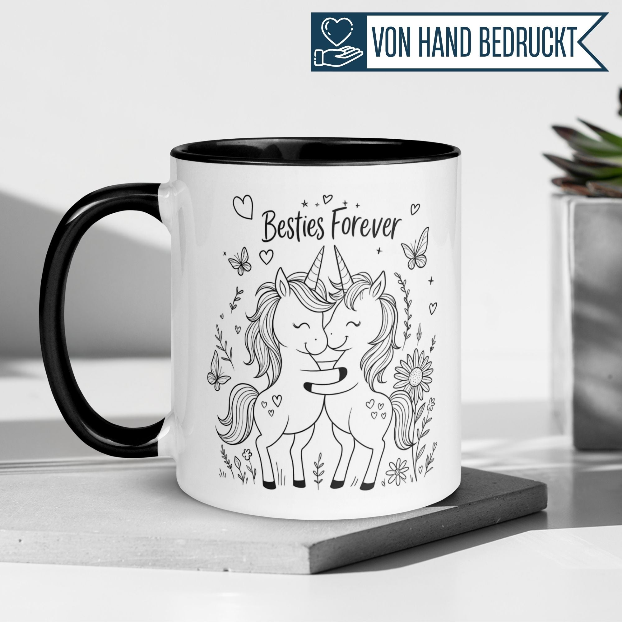 Momentals Tasse mit zwei Einhörnern und "Besties Forever" Motiv, perfekt für Freundschaftsgeschenke.