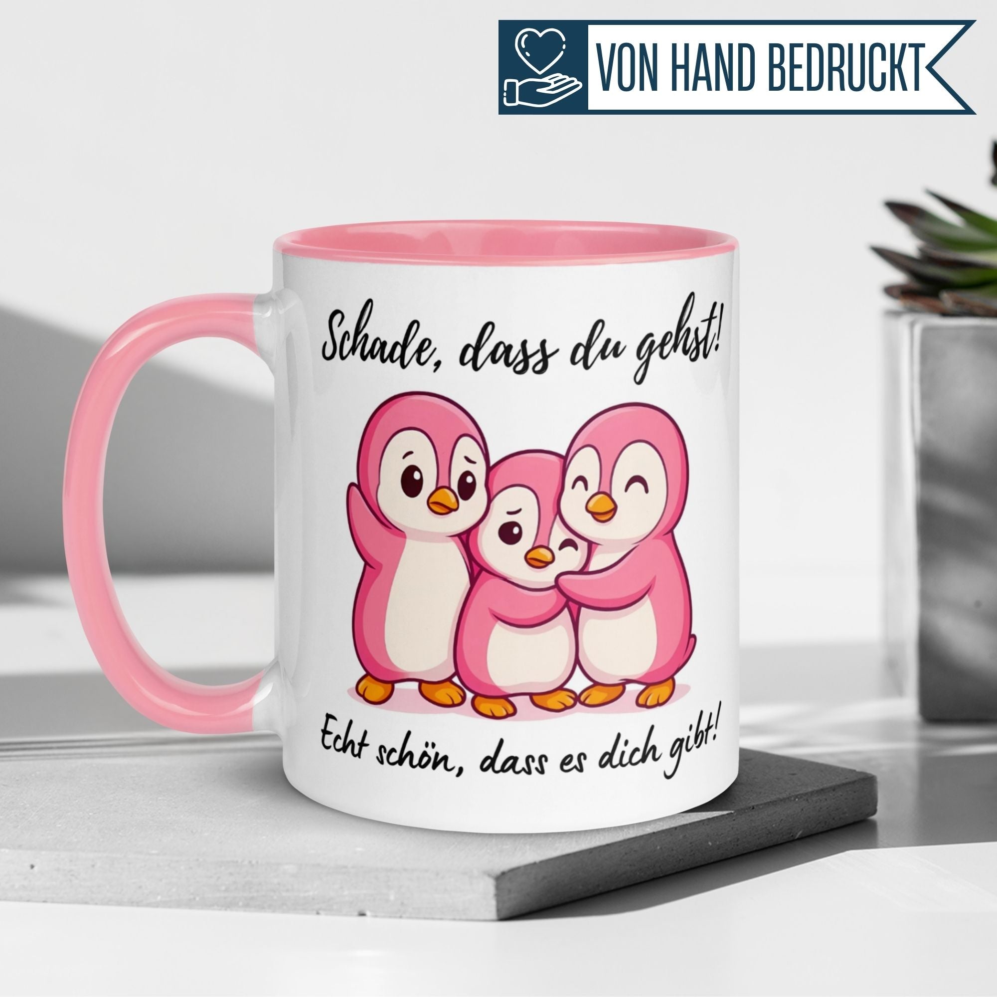 Momentals Tasse mit rosa Pinguinen und Spruch "Schade, dass du gehst!" als Dankeschön für die Kollegin.