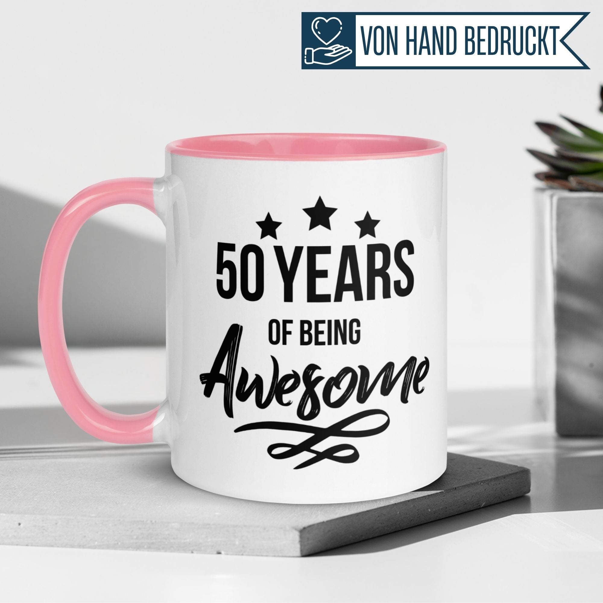Momentals® 50th birthday mug featuring '50 Years of being Awesome' and pink handle, perfect gift for celebrations.