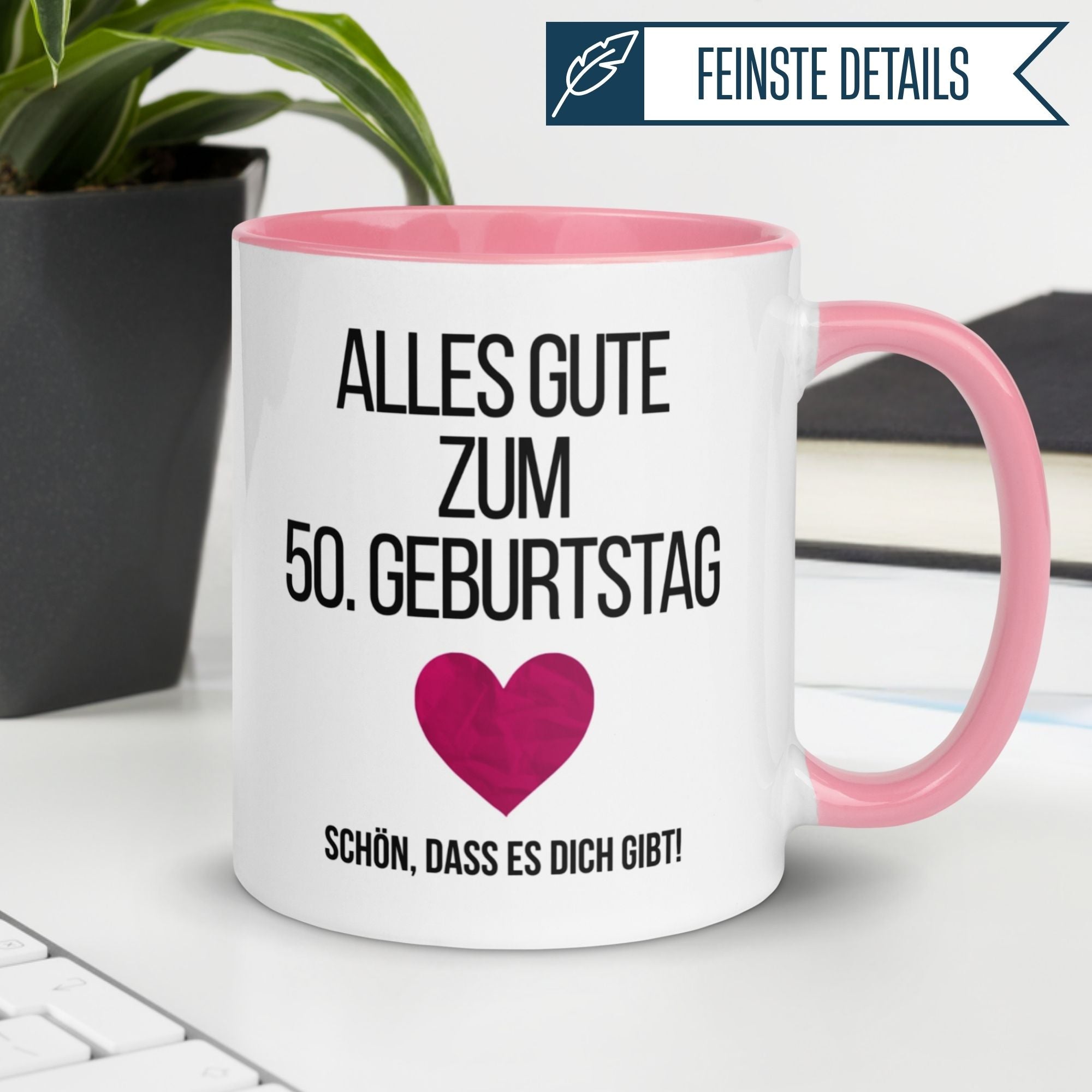 Tasse zum 50. Geburtstag mit Herz und Spruch "Alles Gute zum 50. Geburtstag!" auf pinkem Henkel.