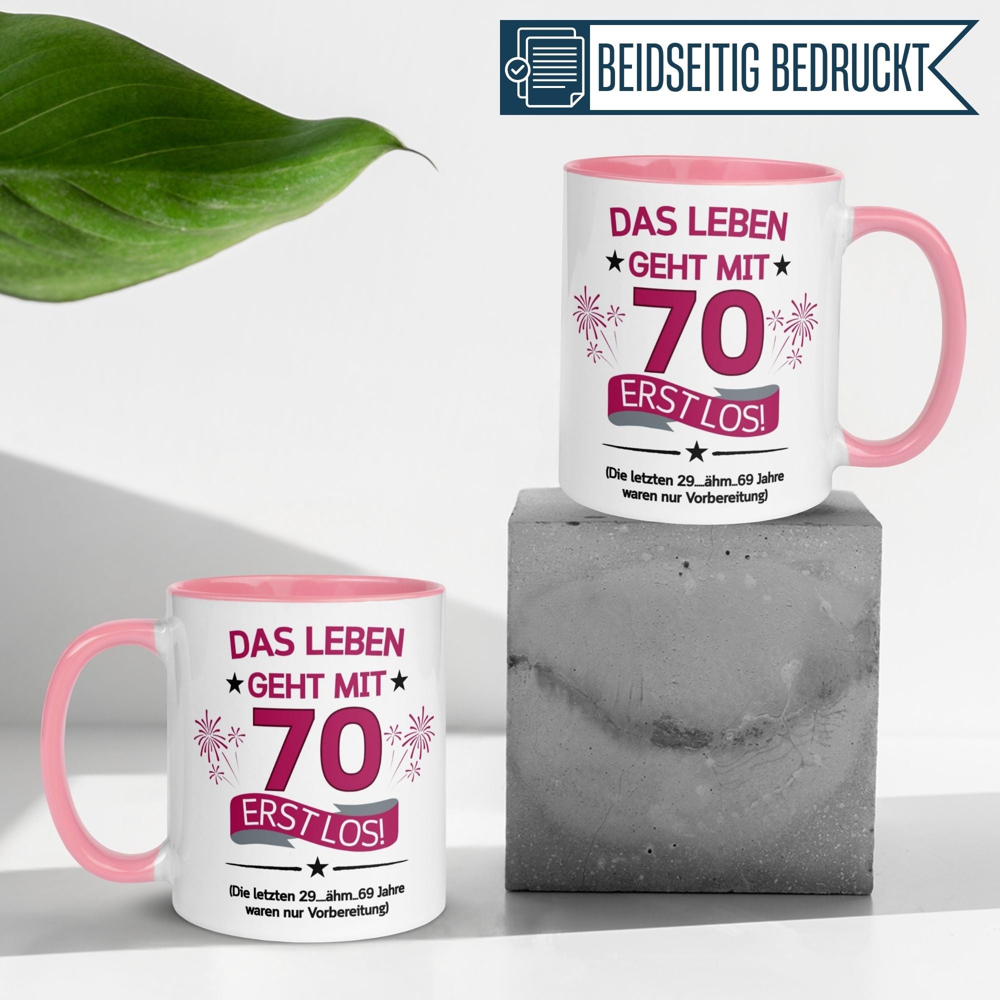 Momentals Tasse für 70. Geburtstag mit Spruch: "Das Leben geht mit 70 erst los!" - Beidseitig bedruckt, pinkes Design.