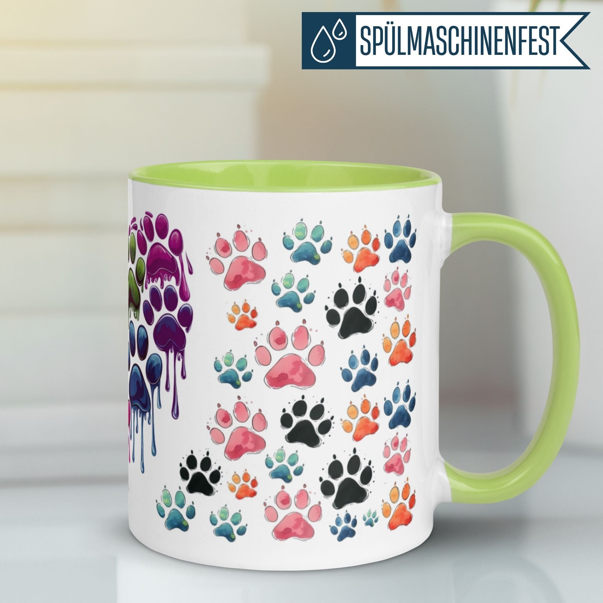 Bunte Katzenpfoten Tasse mit grünem Henkel, spülmaschinenfest für ein liebevolles Frühstück.
